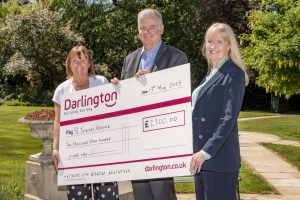 Darlington Building Society with cheque